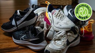 Old Nike running shoes in a pile