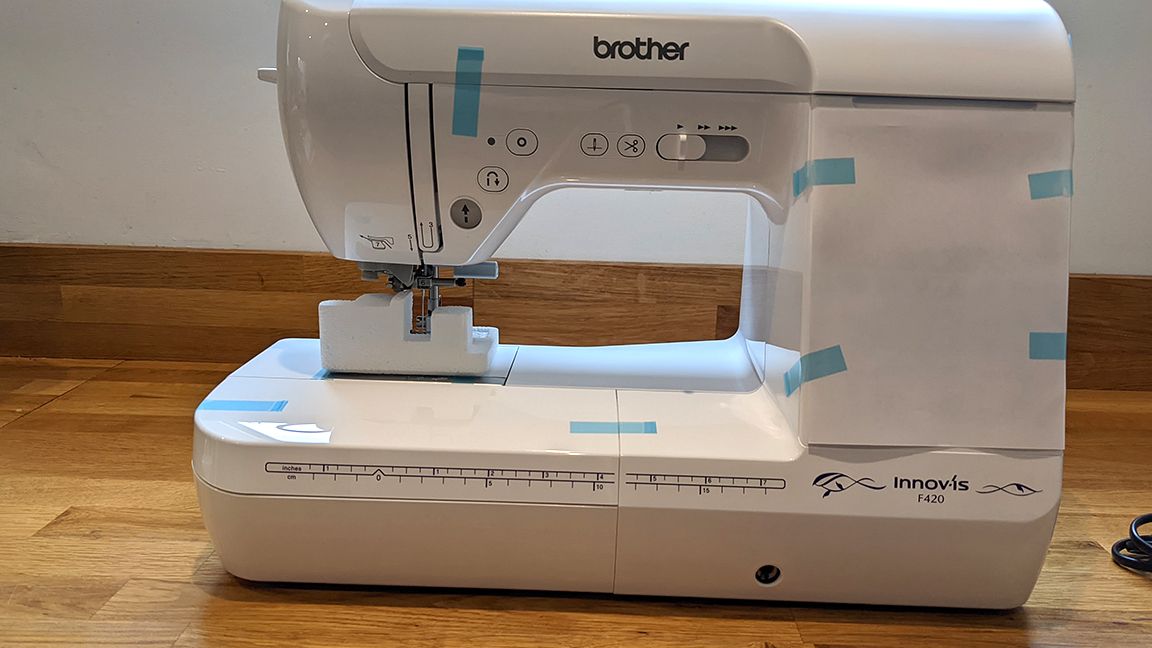 Brother Innovis F420 review, represented by a photo of a sewing machine being assembled