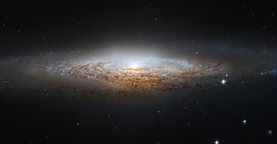 A galactic sideswipe 3 billion years ago warped our Milky Way galaxy