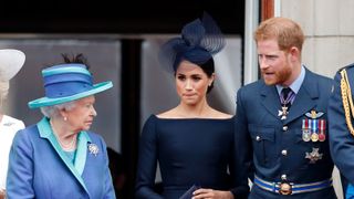 london, united kingdom july 10 embargoed for publication in uk newspapers until 24 hours after create date and time queen elizabeth ii, meghan, duchess of sussex and prince harry, duke of sussex watch a flypast to mark the centenary of the royal air force from the balcony of buckingham palace on july 10, 2018 in london, england the 100th birthday of the raf, which was founded on on 1 april 1918, was marked with a centenary parade with the presentation of a new queen's colour and flypast of 100 aircraft over buckingham palace photo by max mumbyindigogetty images