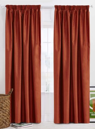 Terracotta Plain Faux Silk Blackout Thermal Curtains slightly open with basket in front on the left side