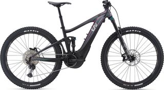 A side view of the Liv Intrigue C E+ 2 electric enduro mountain bike with full suspension and long travel
