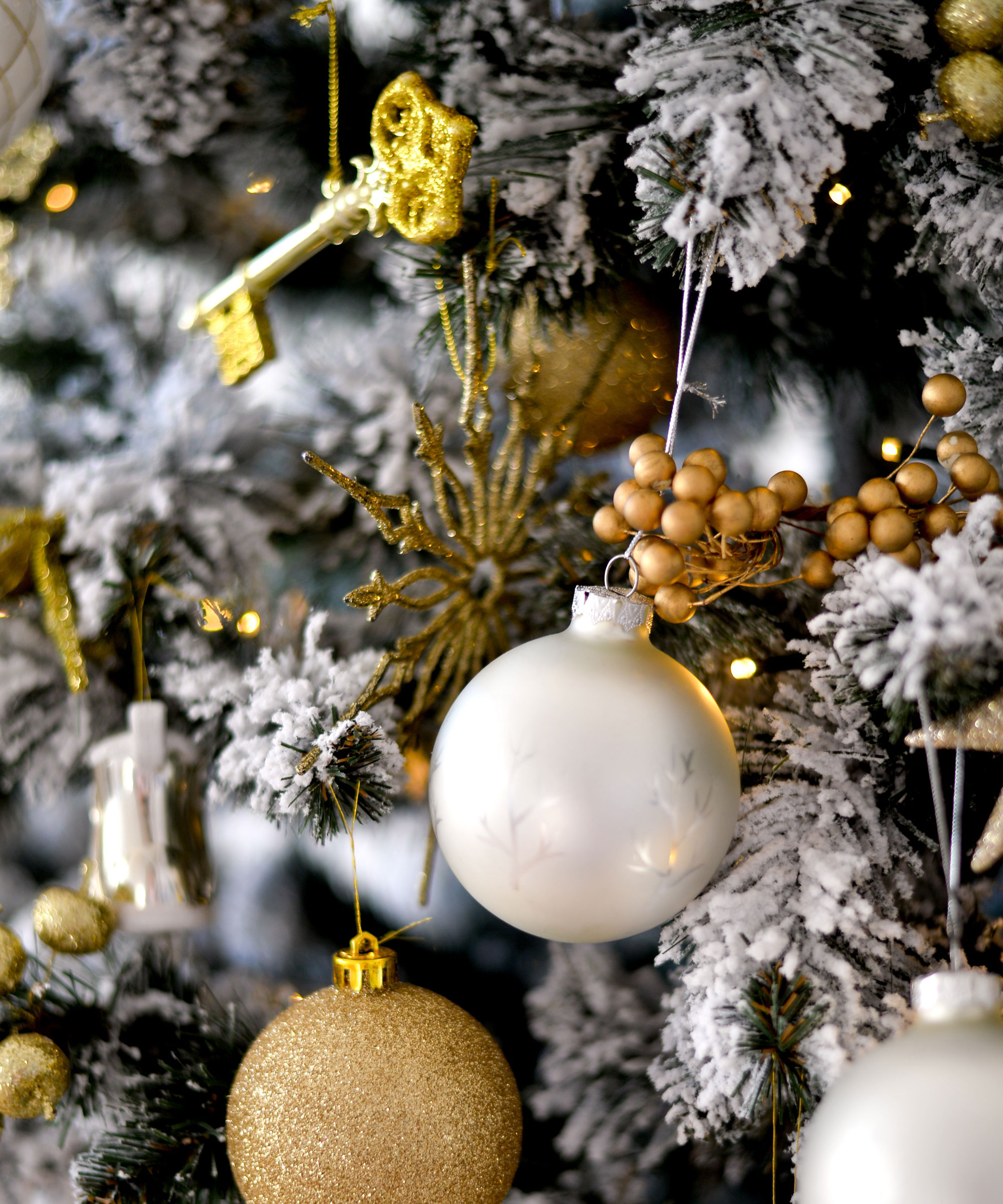 Christmas tree with baubles and snow frosting