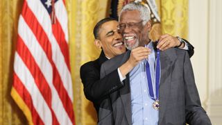 Barack Obama putting the Presidential Medal of Freedom on Bill Russell