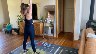 The author doing a workout class with the FITURE Interactive Smart Fitness Mirror