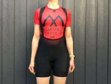 Female cyclist wearing the MAAP Women's Short Team Bib Evo shorts