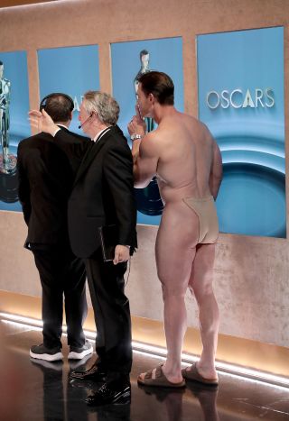 John Cena in a modestly cloth backstage at the Oscars 2024.