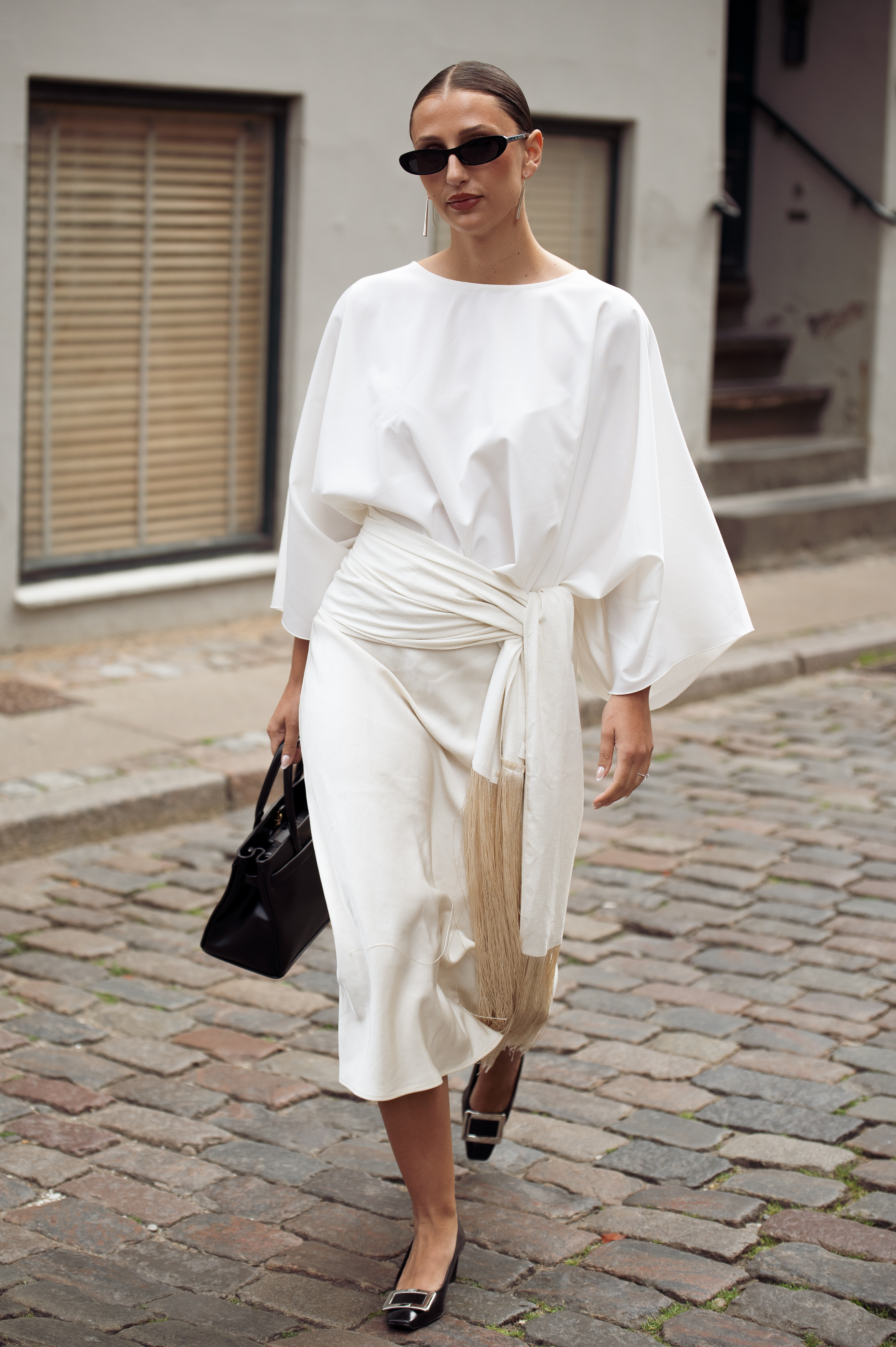 Elisa Grillo wearing an all-white look with black shoe at Copenhagen fashion week.