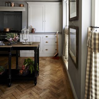 kitchen with white cabinets and wooden table