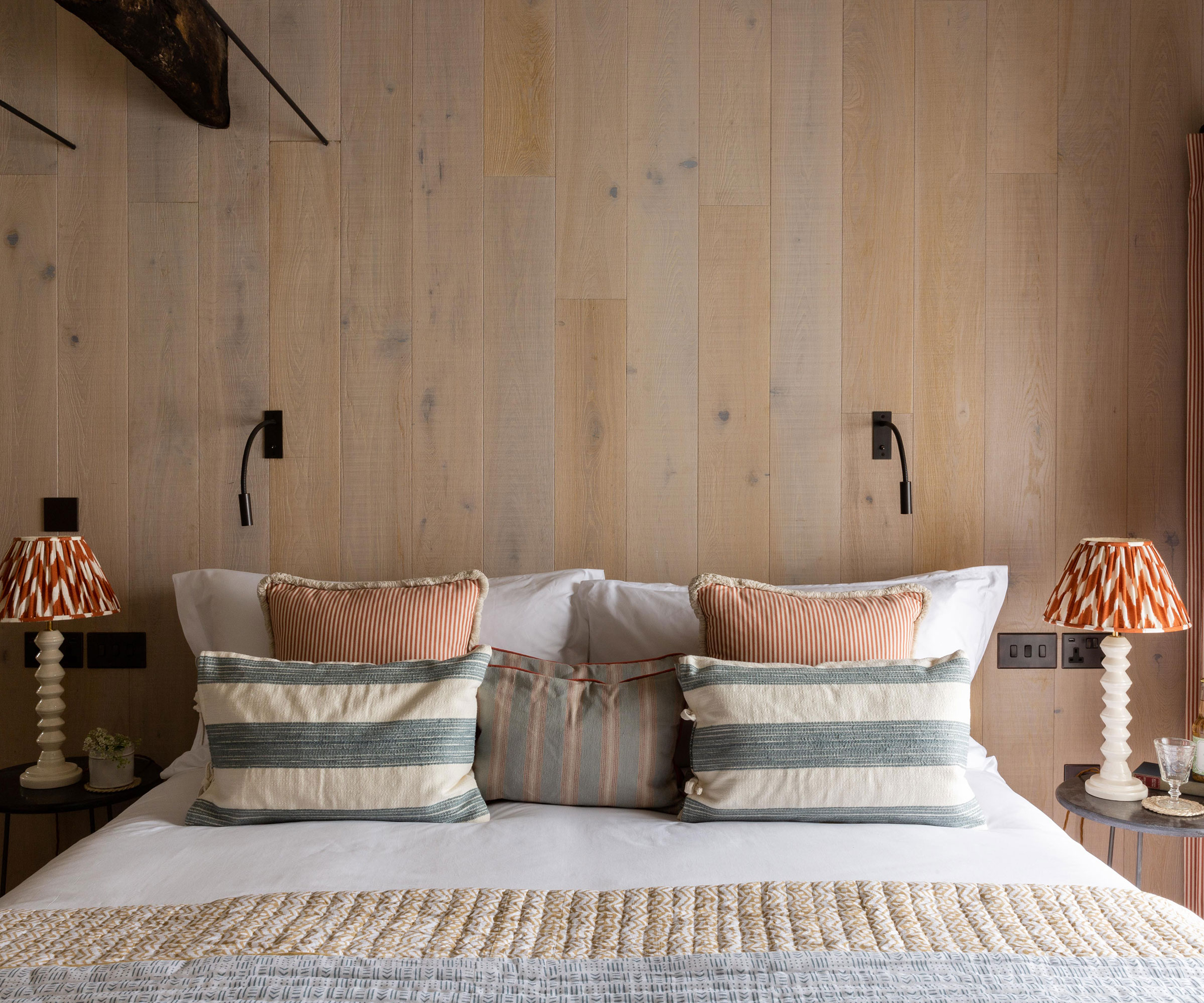 smoked oak wall panelling in a double bedroom