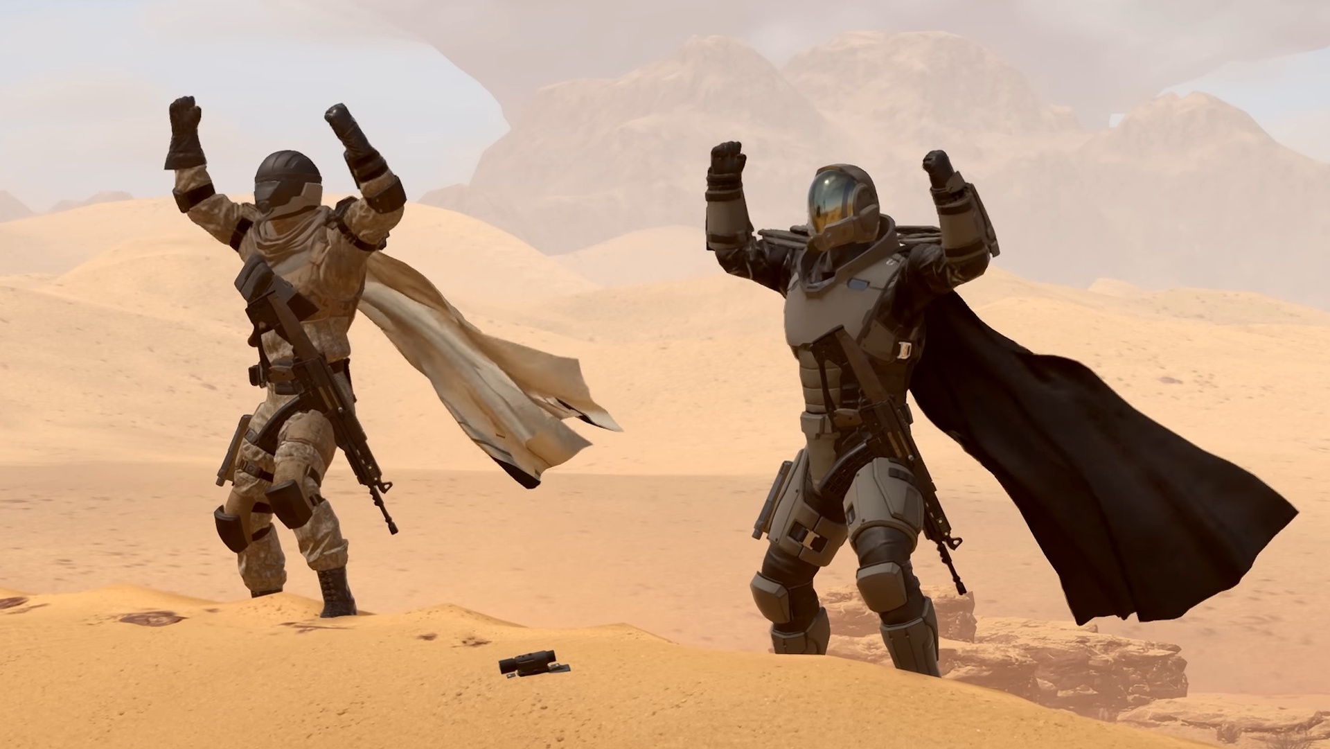 Helldivers 2 screenshot of two soldiers cheering in the desert