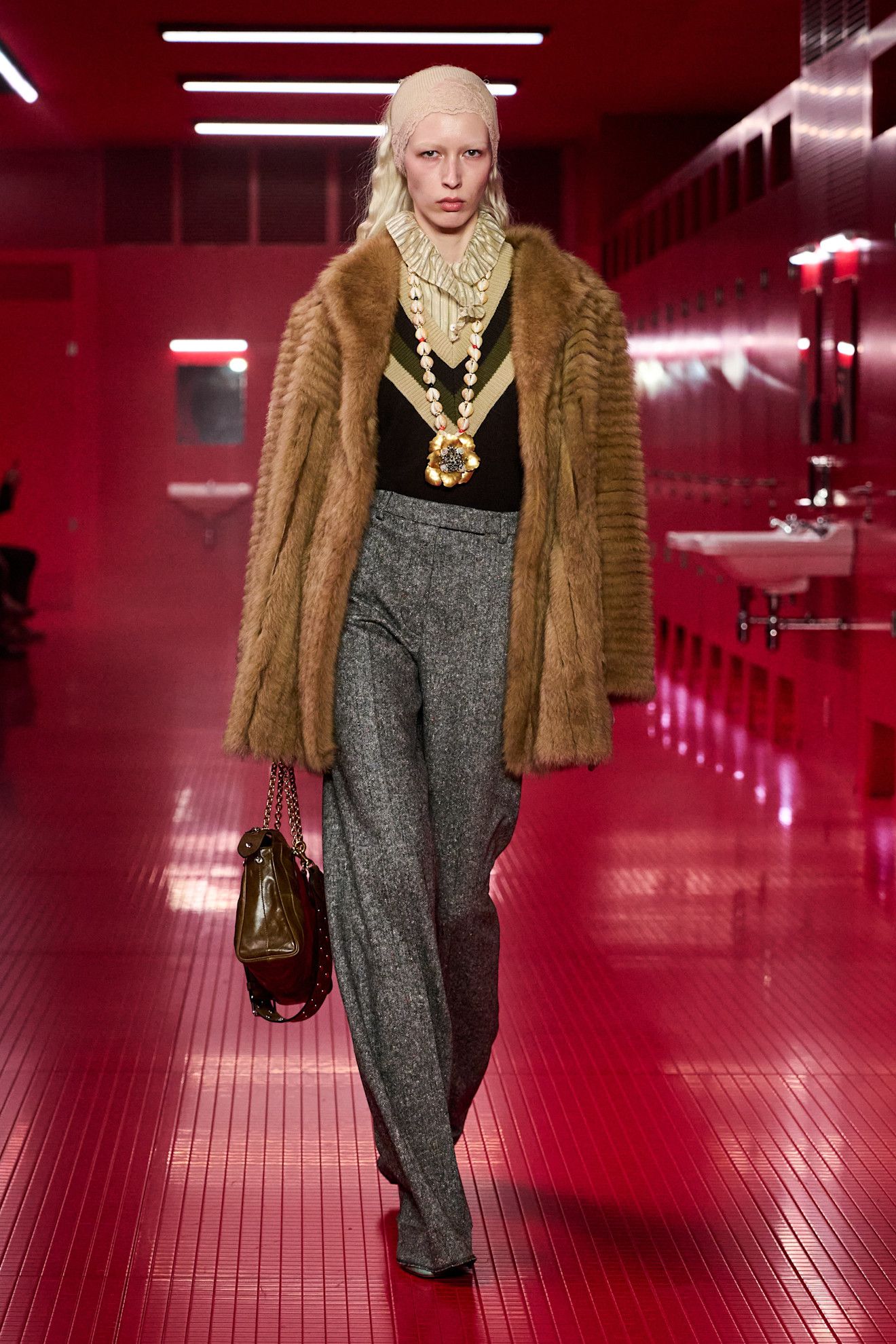 A model on the Valentino runway wearing a long pendant necklace.