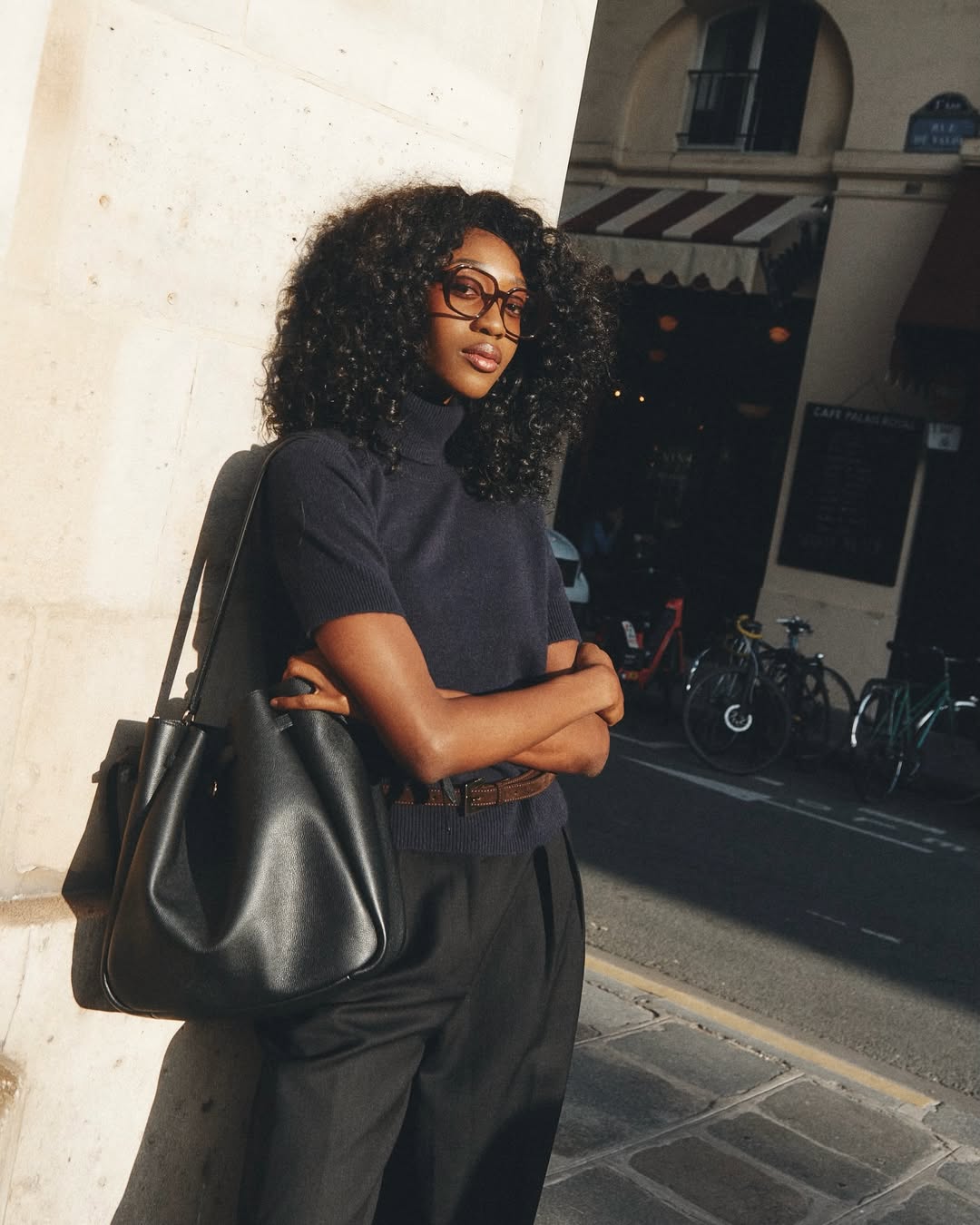 Influencer Emmanuelle Koffi wearing a short-sleeve knit.