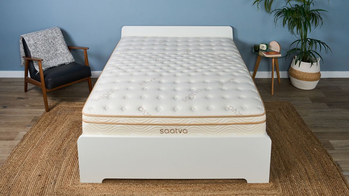 The Saatva Classic mattress on a bed frame in the Tom's Guide Sleep Lab, dressed to look like a bedroom