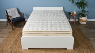The Saatva Classic mattress on a bed frame in the Tom's Guide Sleep Lab, dressed to look like a bedroom