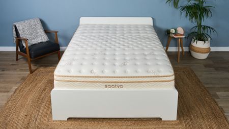 The Saatva Classic mattress on a bed frame in the Tom's Guide Sleep Lab, dressed to look like a bedroom