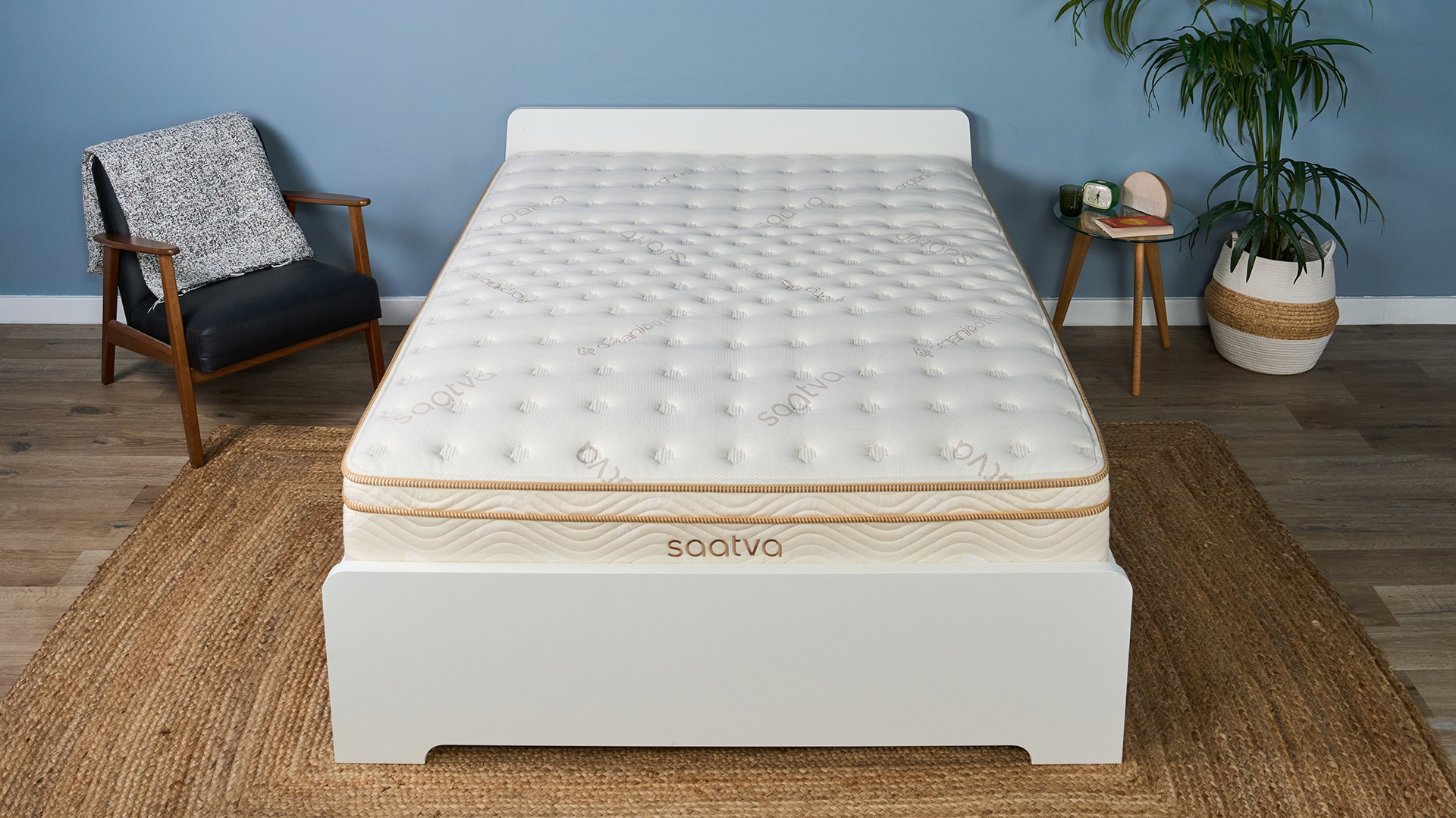 The Saatva Classic mattress on a bed frame in the Tom's Guide Sleep Lab, dressed to look like a bedroom