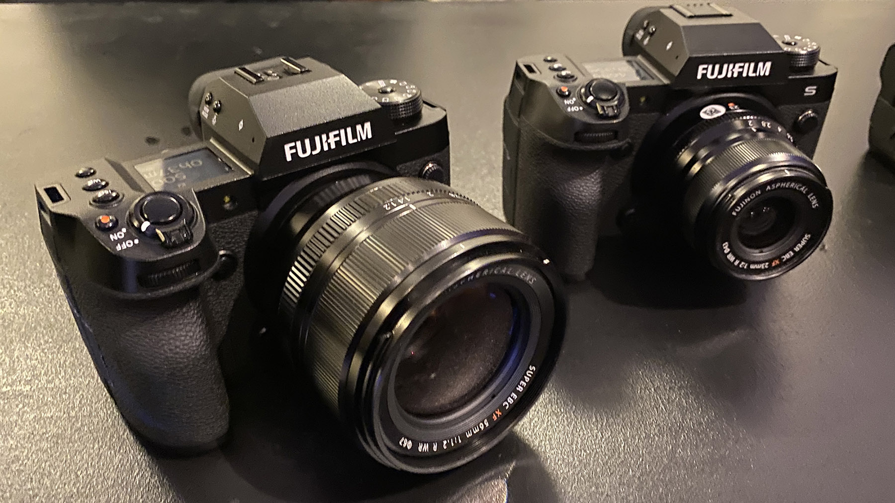 The Fujifilm X-H2 and X-H2S cameras sitting on a table