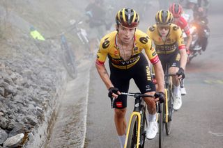 Primož Roglič and Jonas Vingegaard ride away from Vuelta leader Sepp Kuss on the Alto de L'Angliru