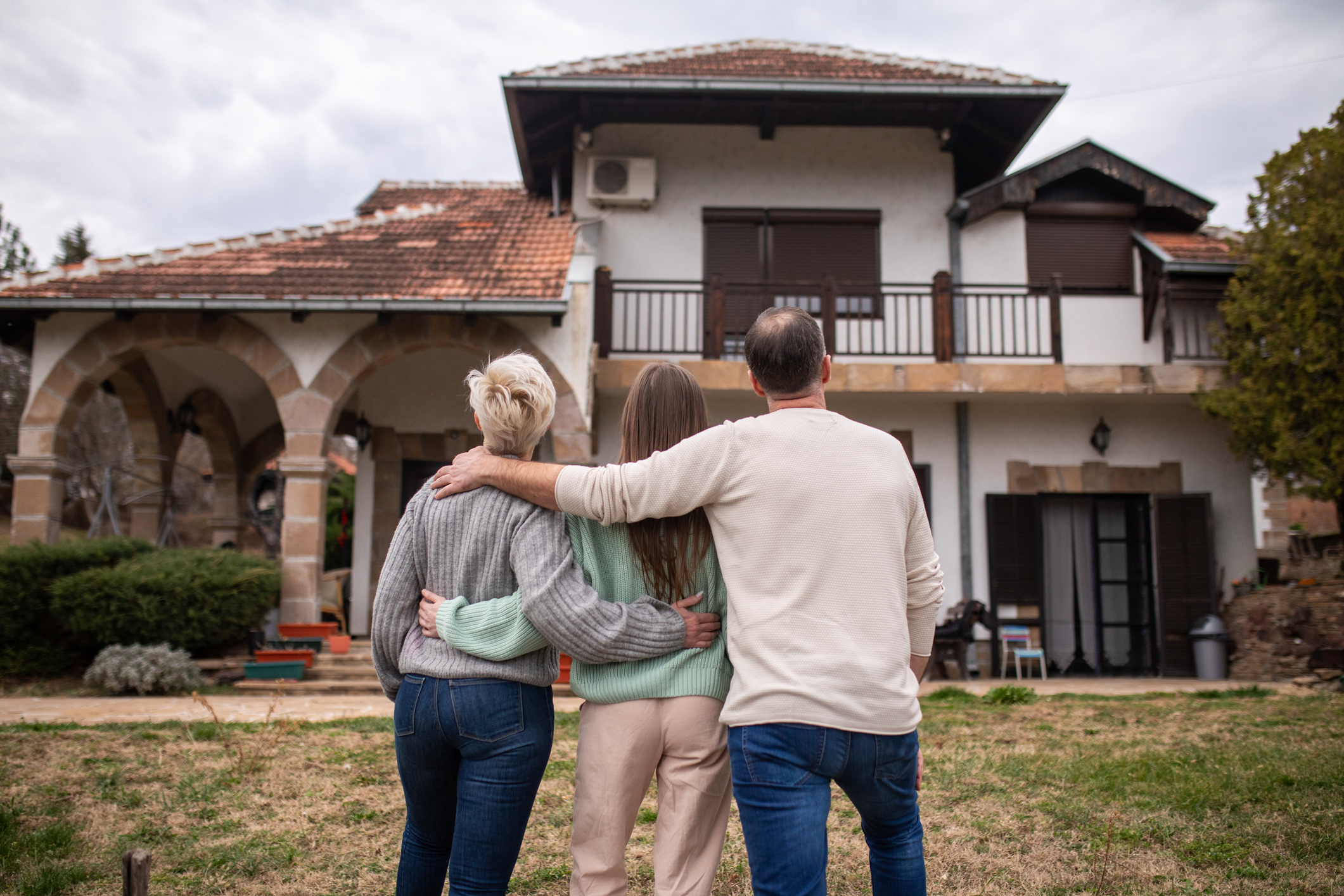 Family admiring their new home together