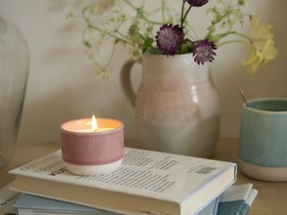 loaf pink candle pot on book