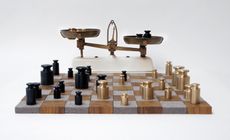Chess set made up of golden and black weights