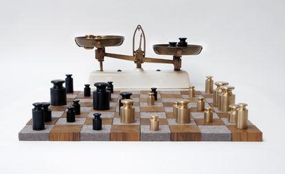 Chess set made up of golden and black weights