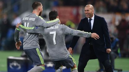Sergio Ramos and Cristiano Ronaldo celebrate with Zinedine Zidane