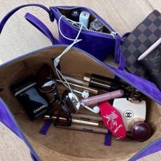 Rachelle Rowlings’ travel bag full of Chanel, Rhode, and Merit makeup.