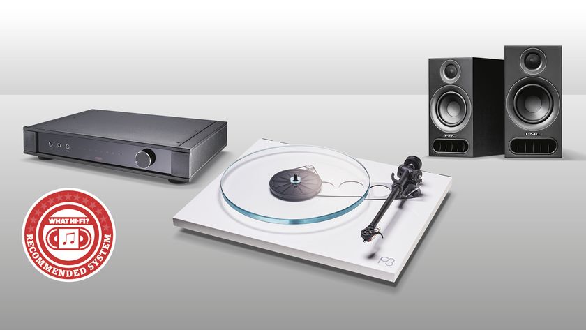 speakers, amplifier and turntable on a grey background