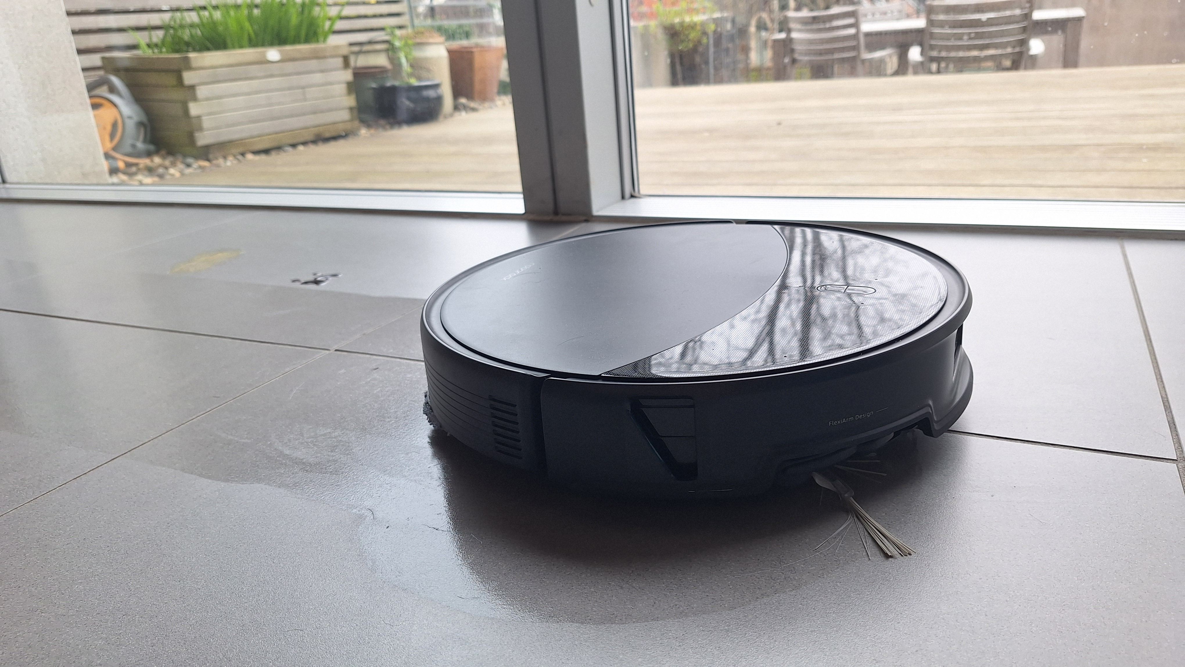 Roborock Saros 20 mopping a tiled floor