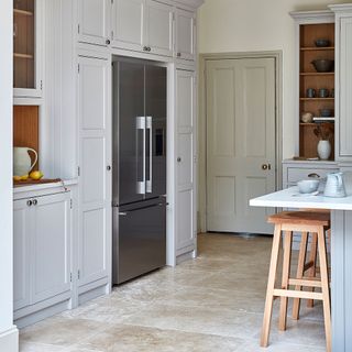 kitchen with white drawers and wooden shelves