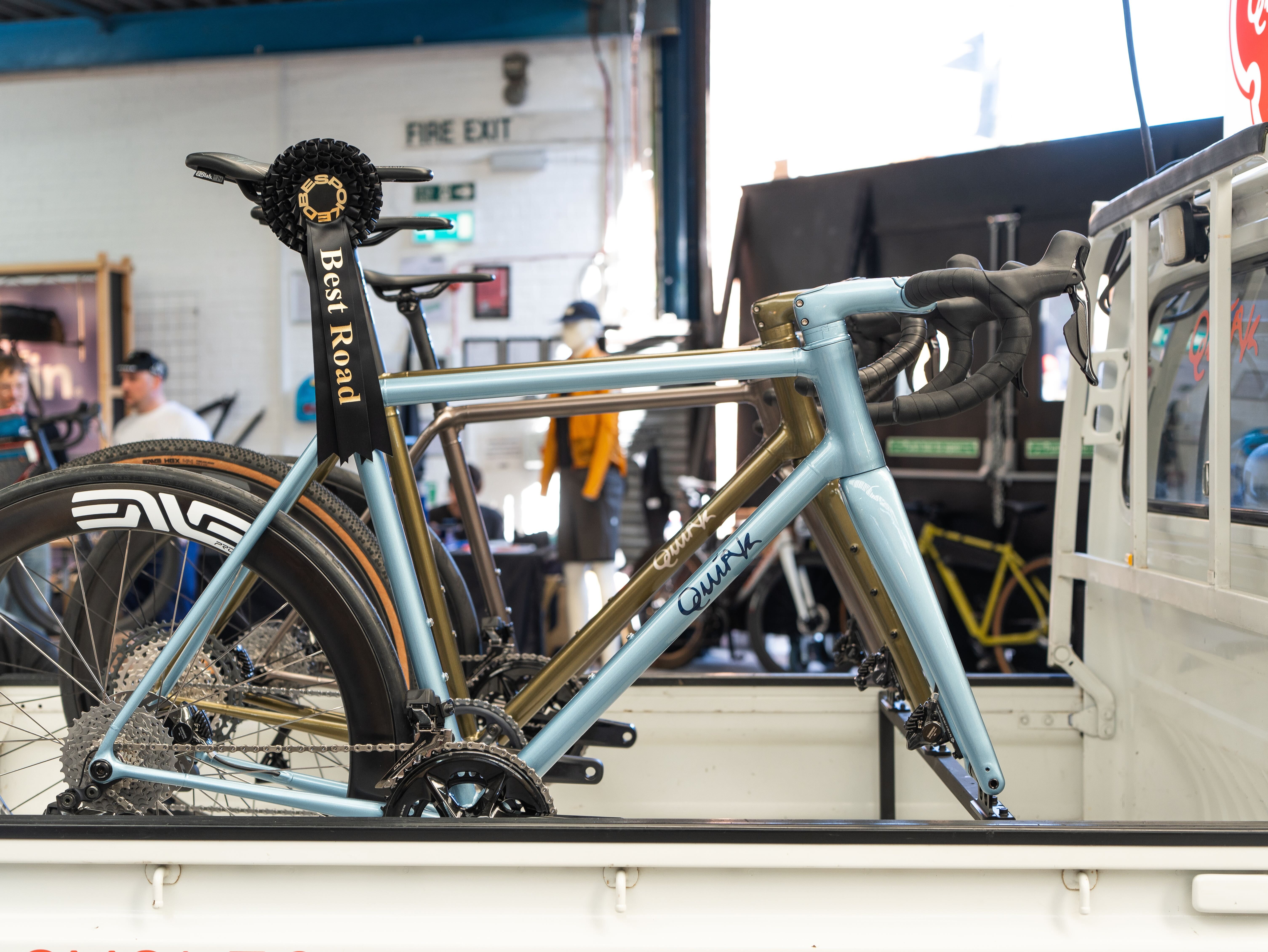Quirk cycle on back of a Honda Alty delivery truck adorned in Japanese decals