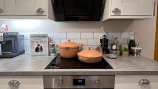 Our Place Black Friday sale - 2 Our Place pans in pink on electric hob