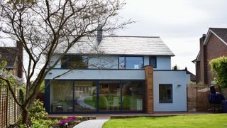 exterior of property that has been upgraded with render, new windows and roof