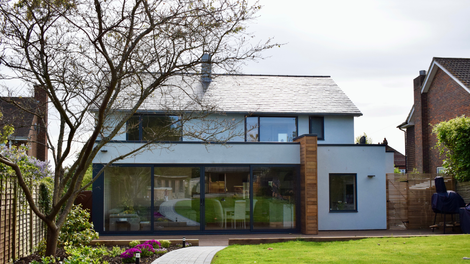 exterior of property that has been upgraded with render, new windows and roof