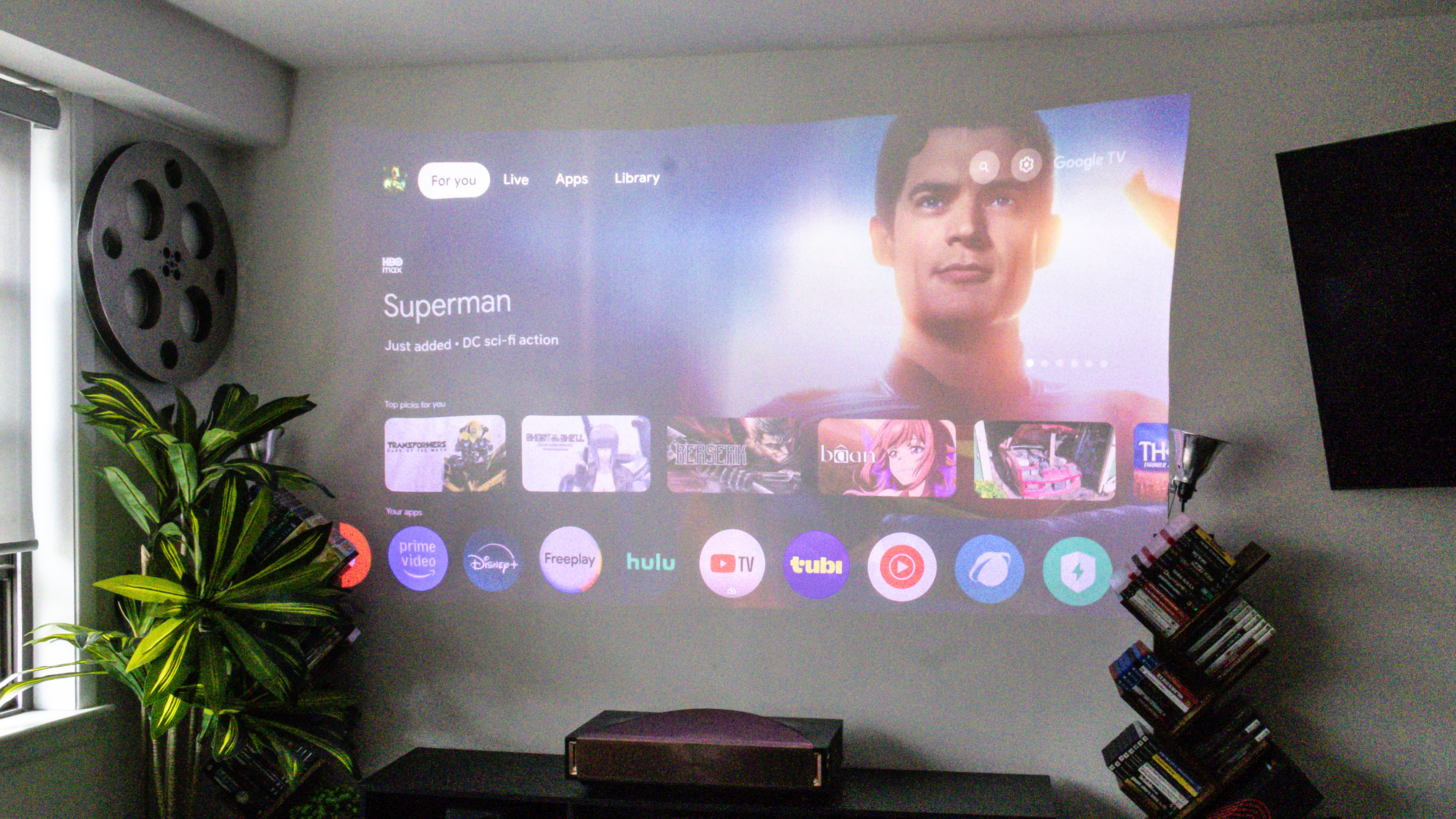 The Hisense L9Q UST projector in a living room