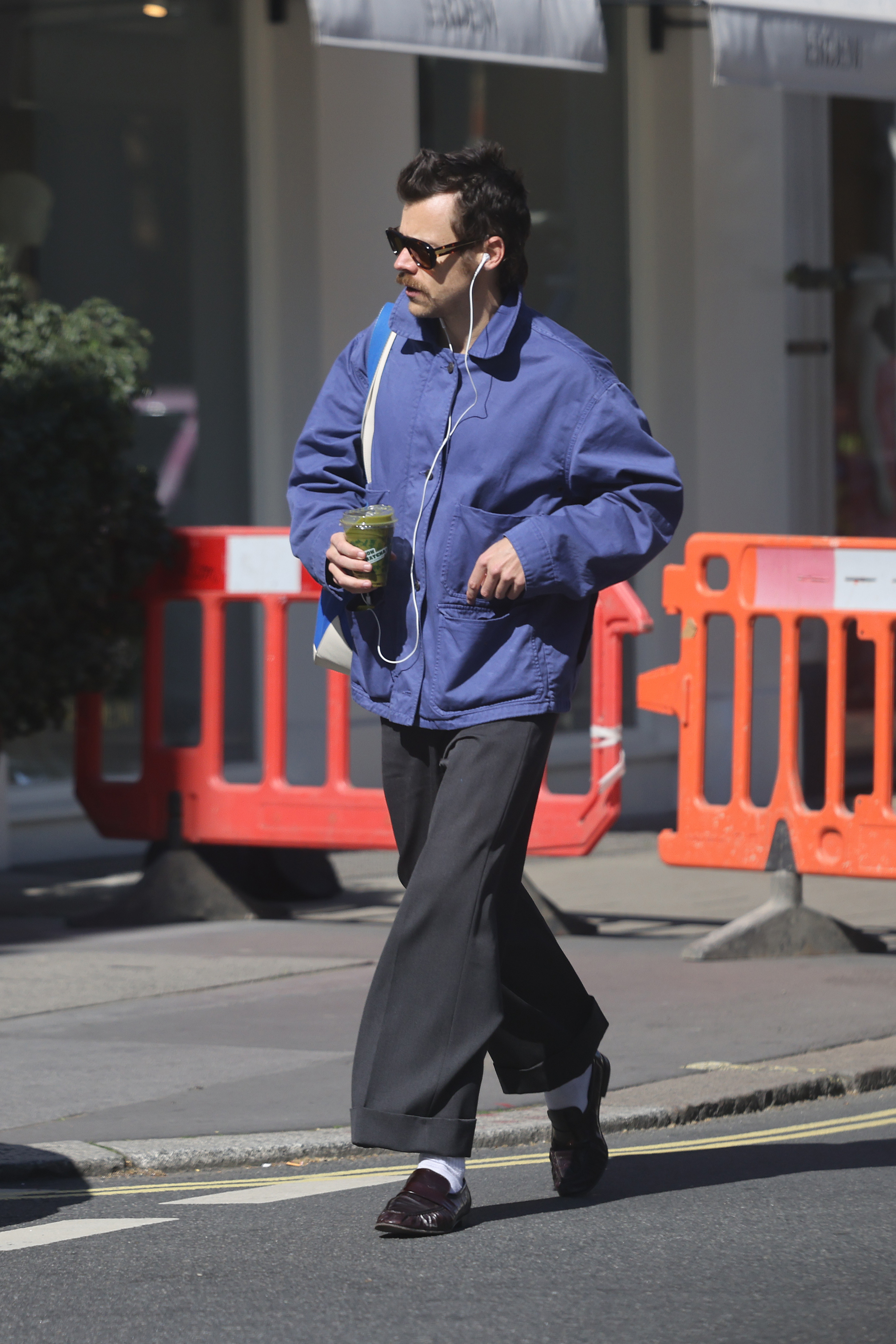 An image of Harry Styles wearing a country jacket in 2025.