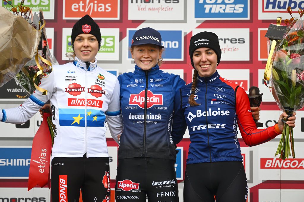 HULST NETHERLANDS NOVEMBER 27 LR Fem Van Empel of The Netherlands and Team Pauwels Sauzen Bingoal on second place race winner Puck Pieterse of The Netherlands and Team AlpecinDeceuninck and Shirin Van Anrooij of The Netherlands and Team Baloise Trek Lions on third place pose on the podium ceremony after the 7th UCI Cyclocross World Cup Hulst 2022 Womens Elite CXWorldCup on November 27 2022 in Hulst Netherlands Photo by Luc ClaessenGetty Images