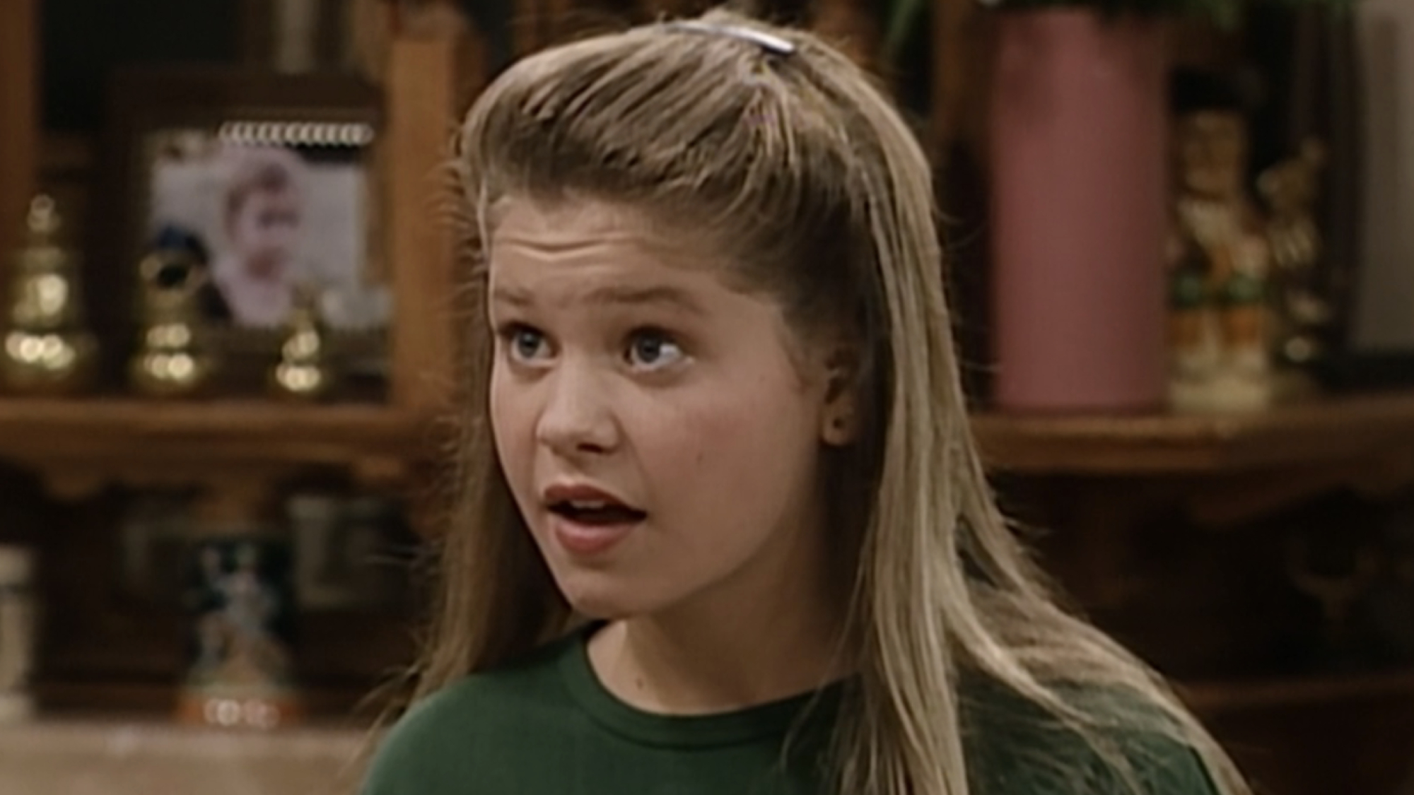 Candace Cameron Bure as DJ Tanner in Full House.
