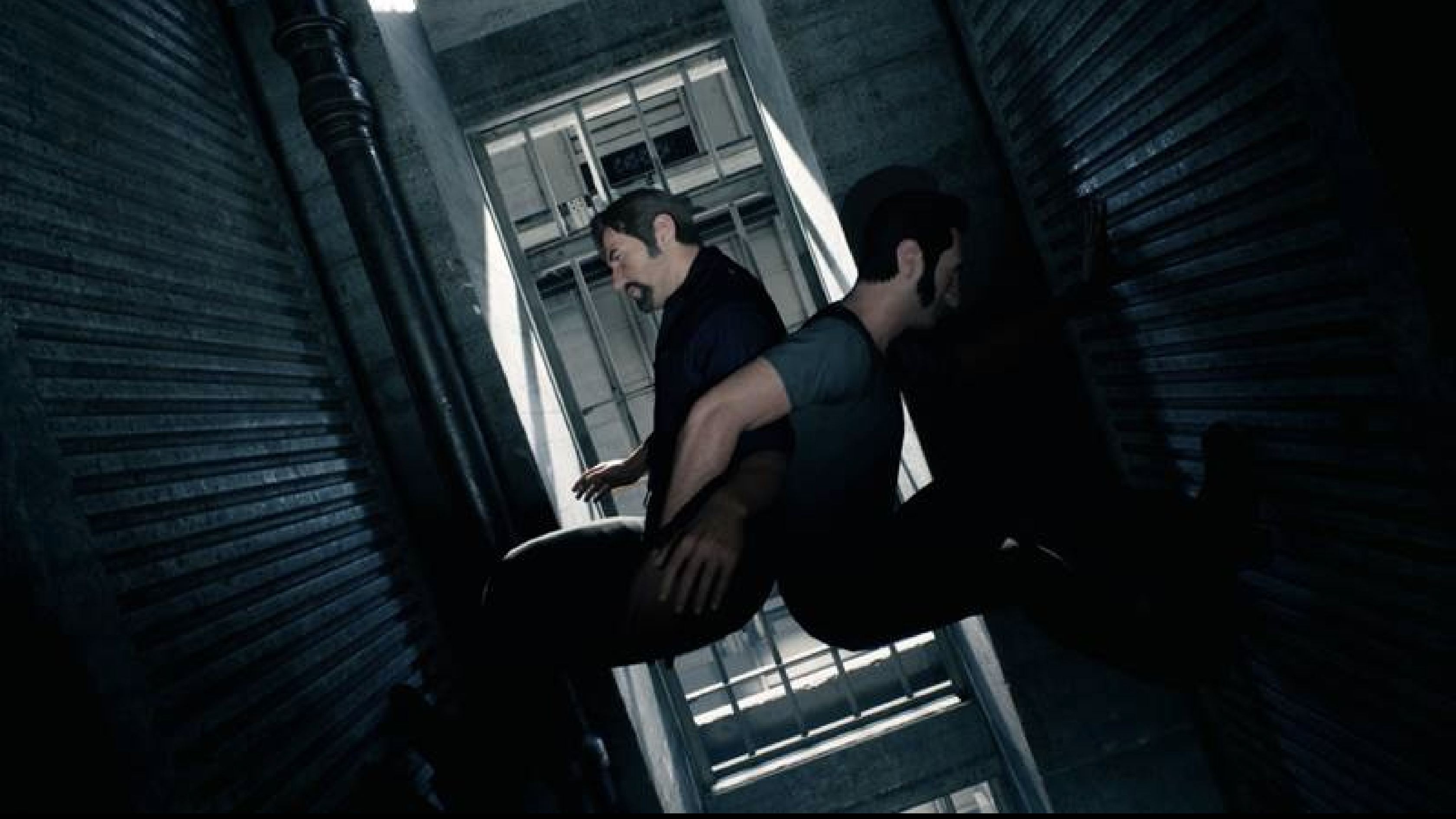 Two men with arms linked going up a shaft by their feet