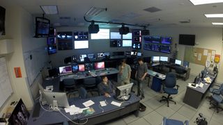 The control room at the LIGO Observatory, Livingston, Louisiana. Seen are senior research scientist Valery Frolov, filmmaker Kai Staats, and audio engineer Joe Chilcott.