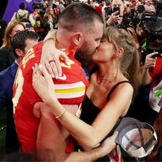 Travis Kelce and Taylor Swift kissing at the Super Bowl GettyImages-2004247308