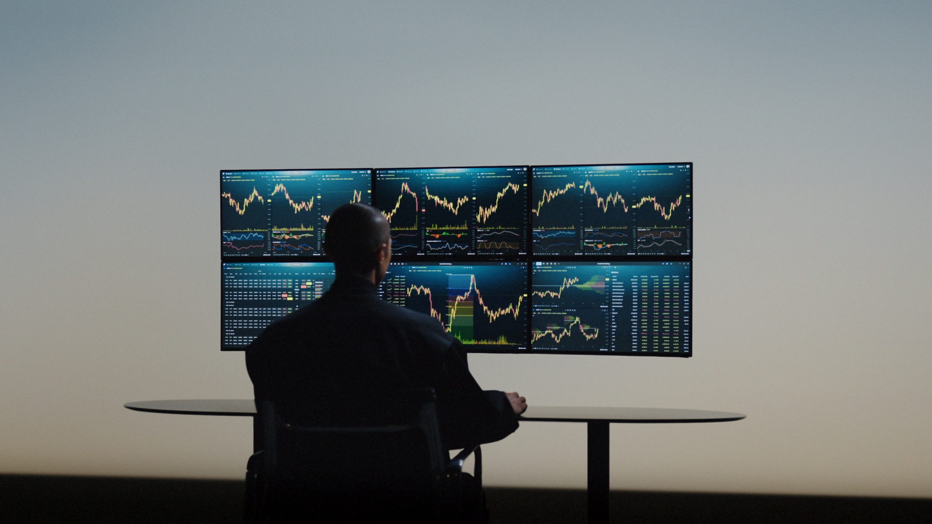 Robinhood trading - someone looking at screens with graphs on