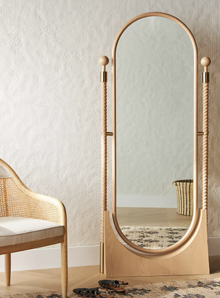 Natural ash wood oval floor mirror from Anthropologie.