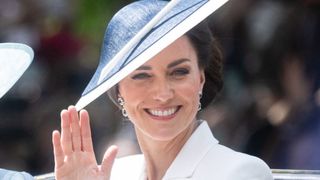 A close up of Kate Middleton in a hat