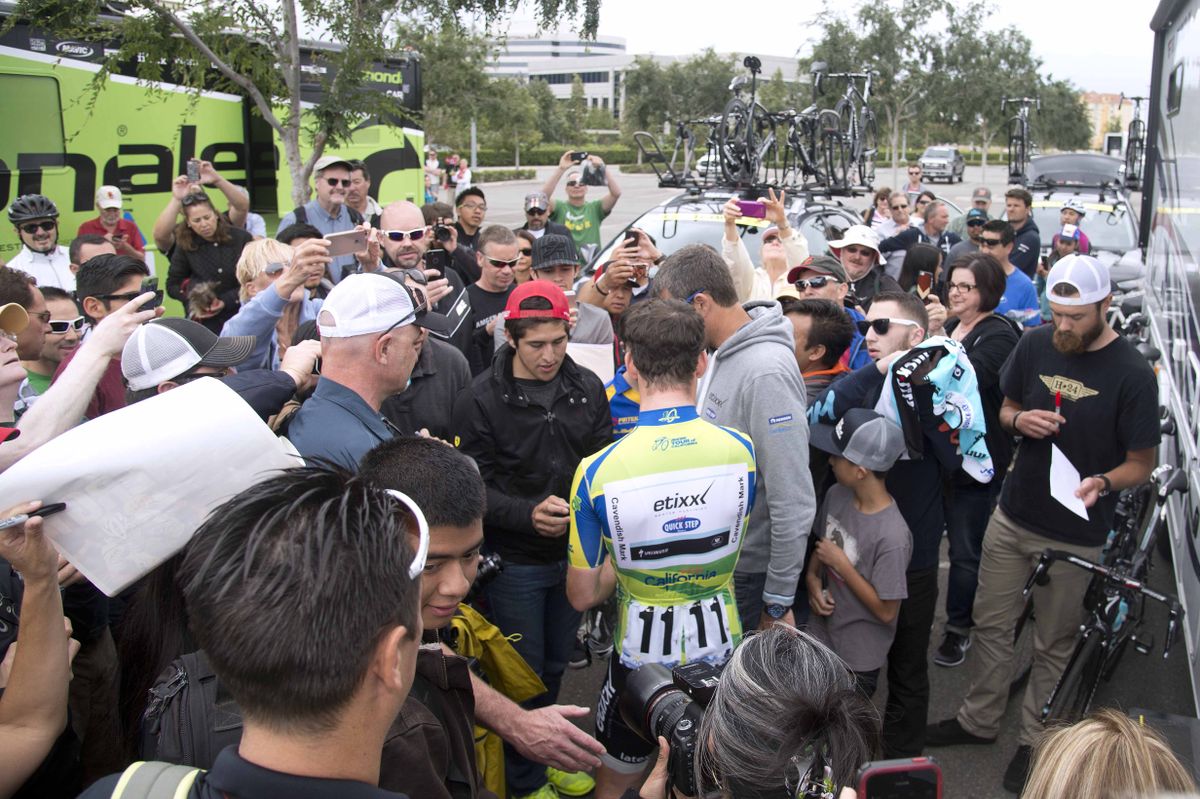 The fans flock to Mark Cavendish for autographs and selfies at the start of the stage