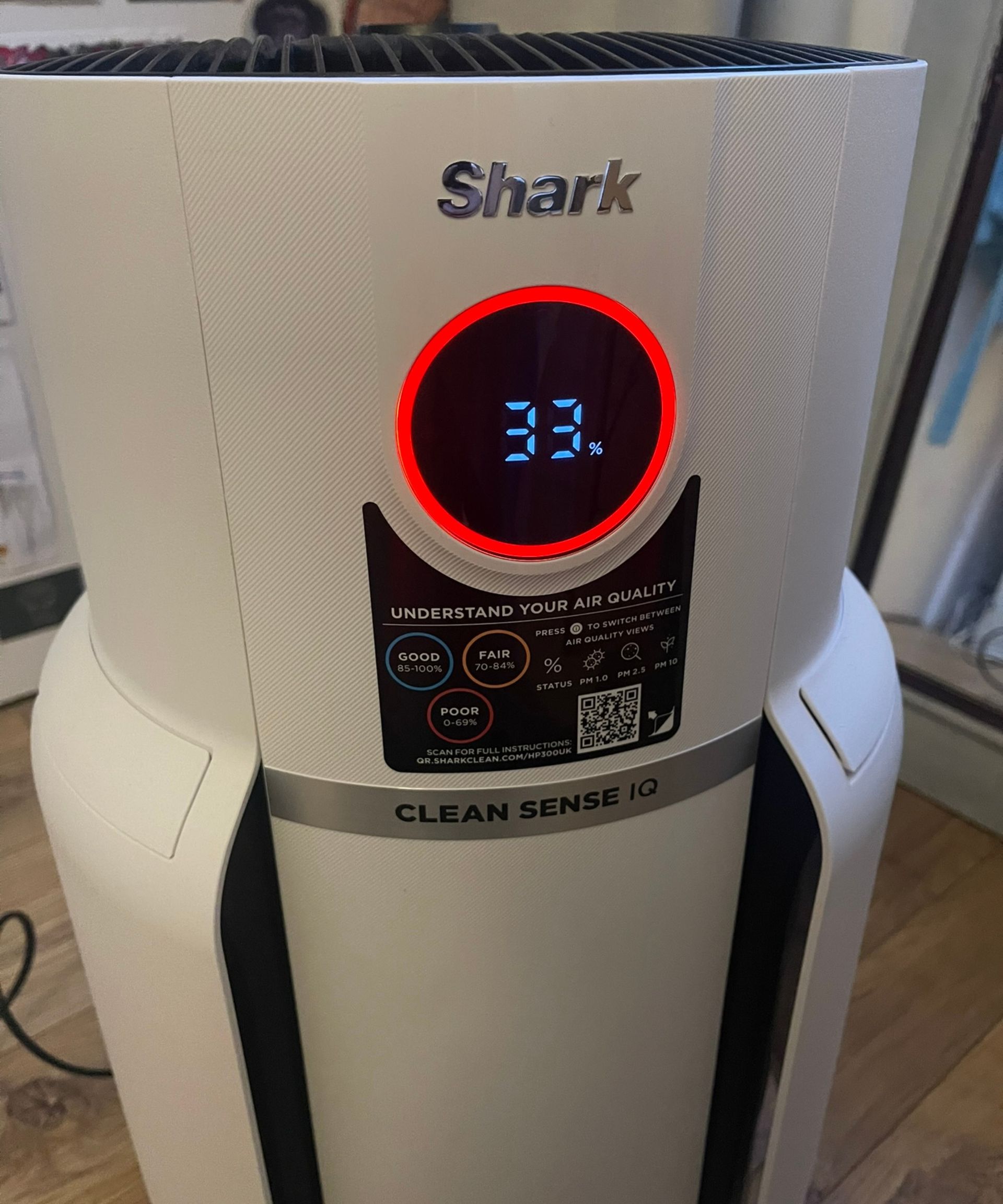 Red indicator displaying 33% air quality while testing the Shark NeverChange Air Purifier Max in my home in Bristol, UK.