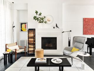 White living room with midcentury art and furniture byJamie Nesbitt-Weber