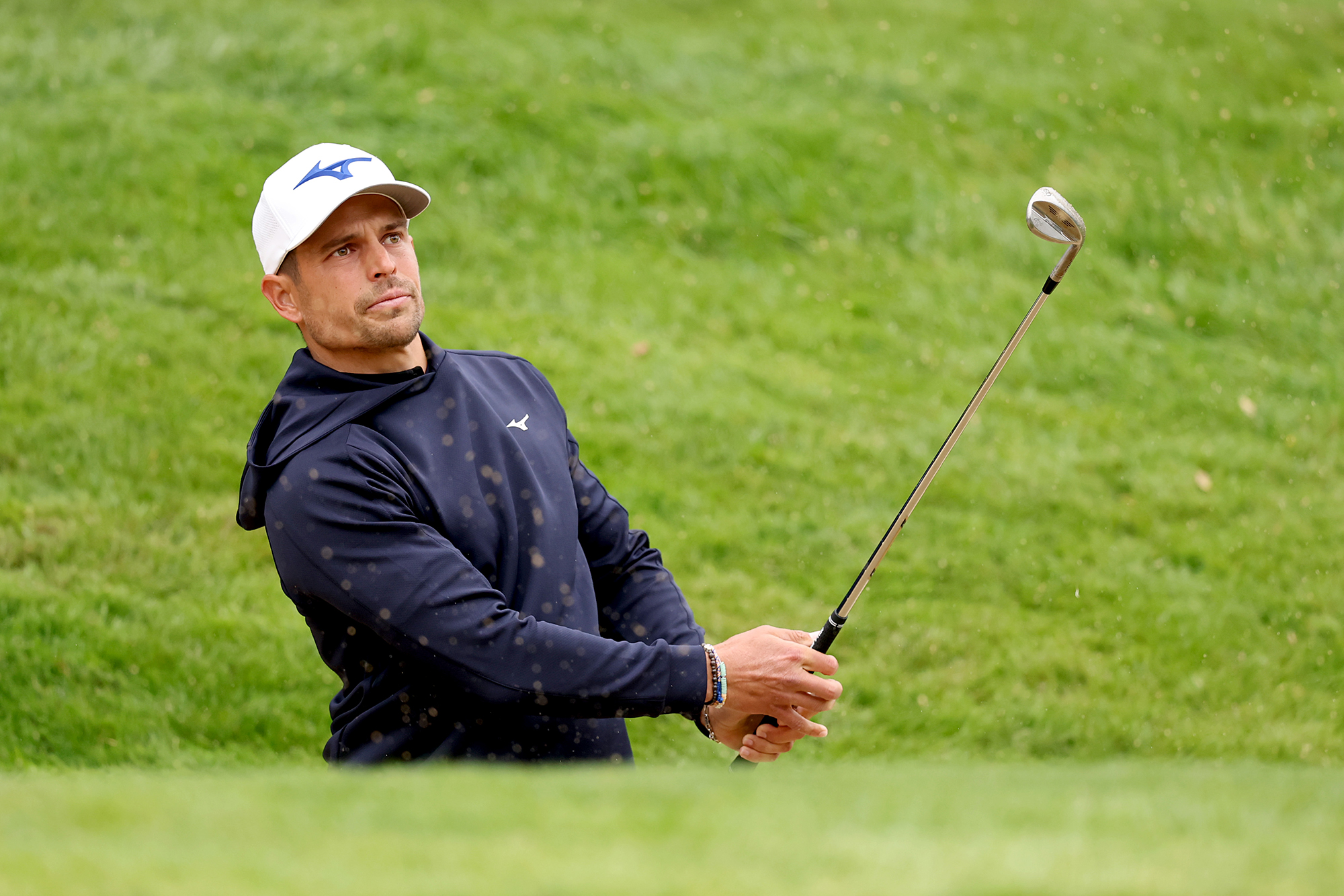 Adrien Saddier in the finish position with a wedge after hitting a shot around the green at the BMW PGA Championship
